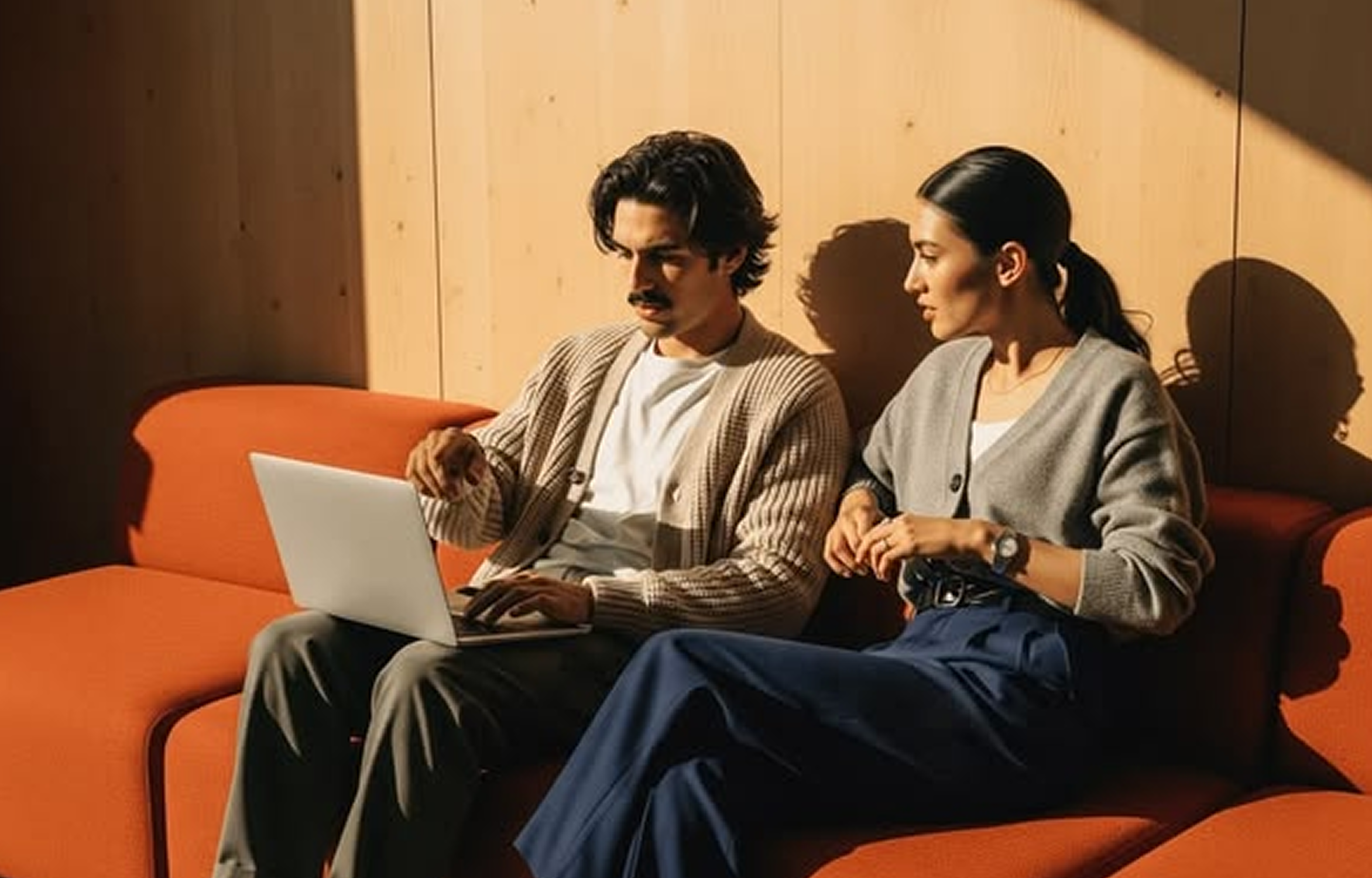 Branding team collaborating on a laptop